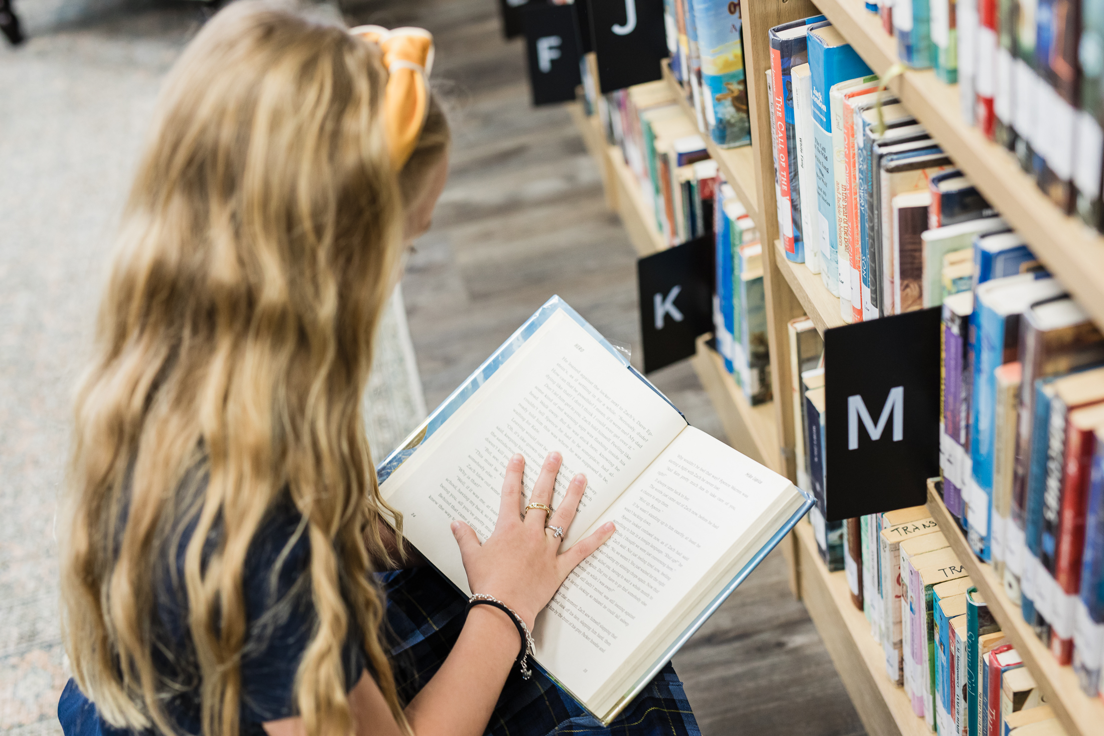 Students reading challenging books at PCS, a private Christian school in Houston, TX.